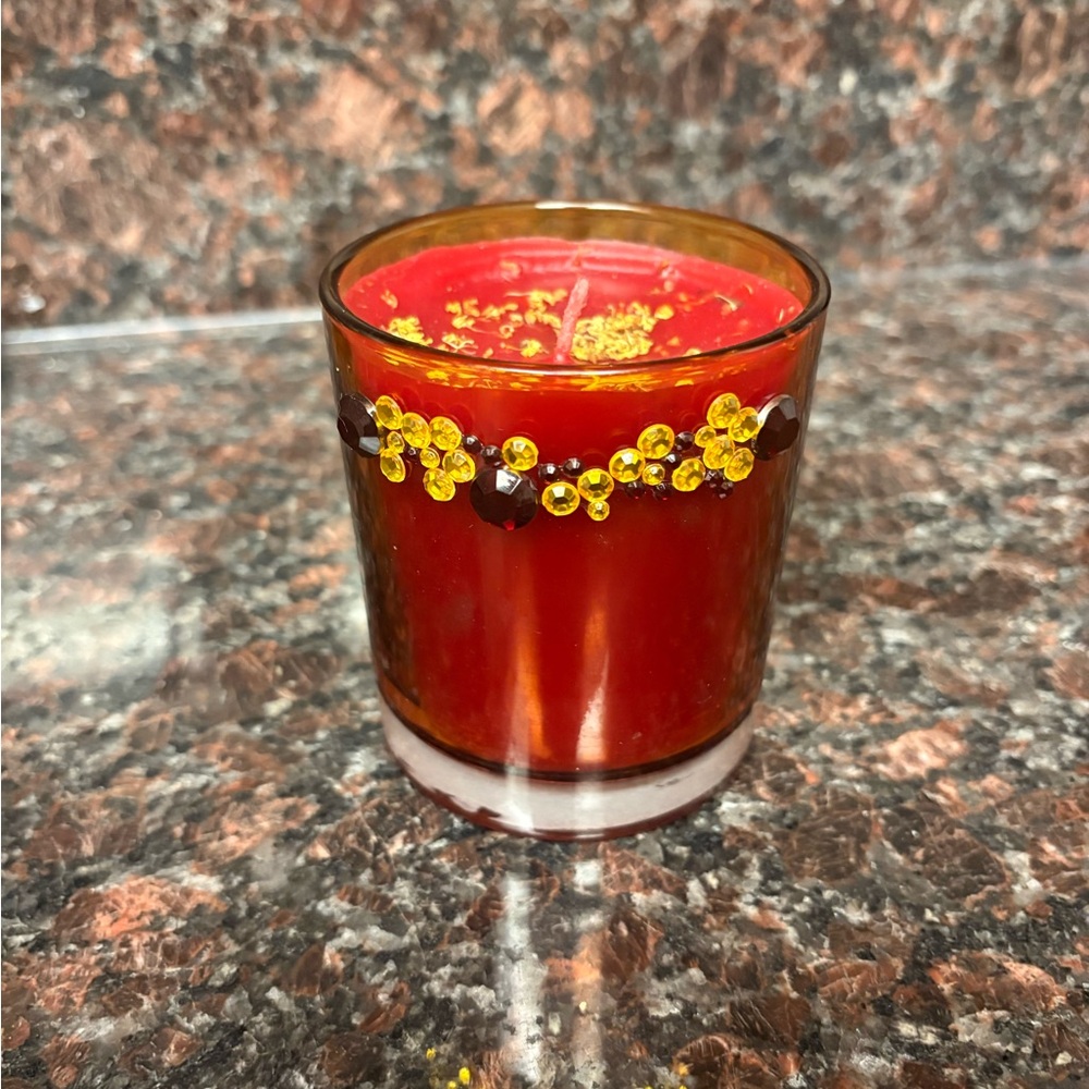 Handmade upcycled candle red wax with sweet cinnamon scent and floral flakes